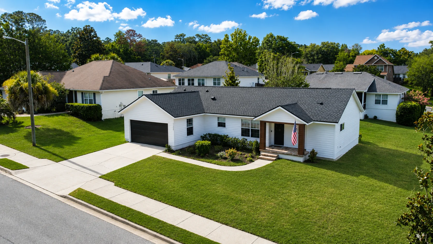 Elevated aerial street view of the property