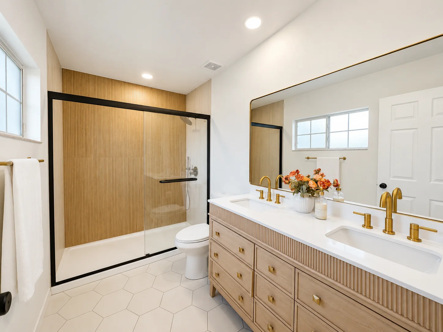 Remodeled primary bathroom with double vanity